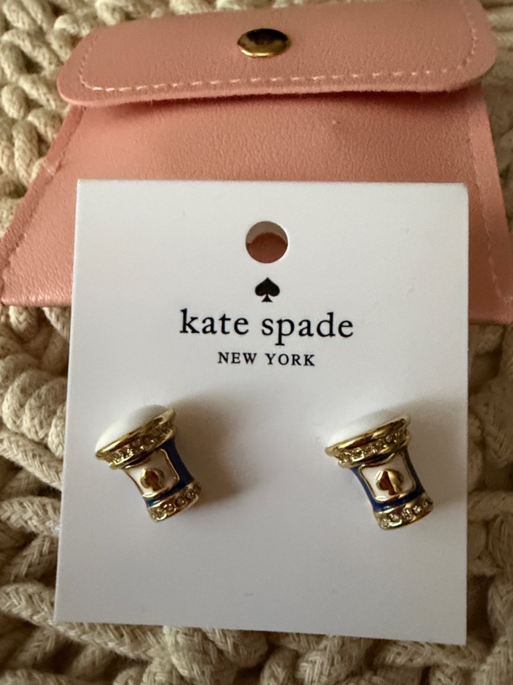 kate spade pink leather coin pouch with gold-tone stud earrings